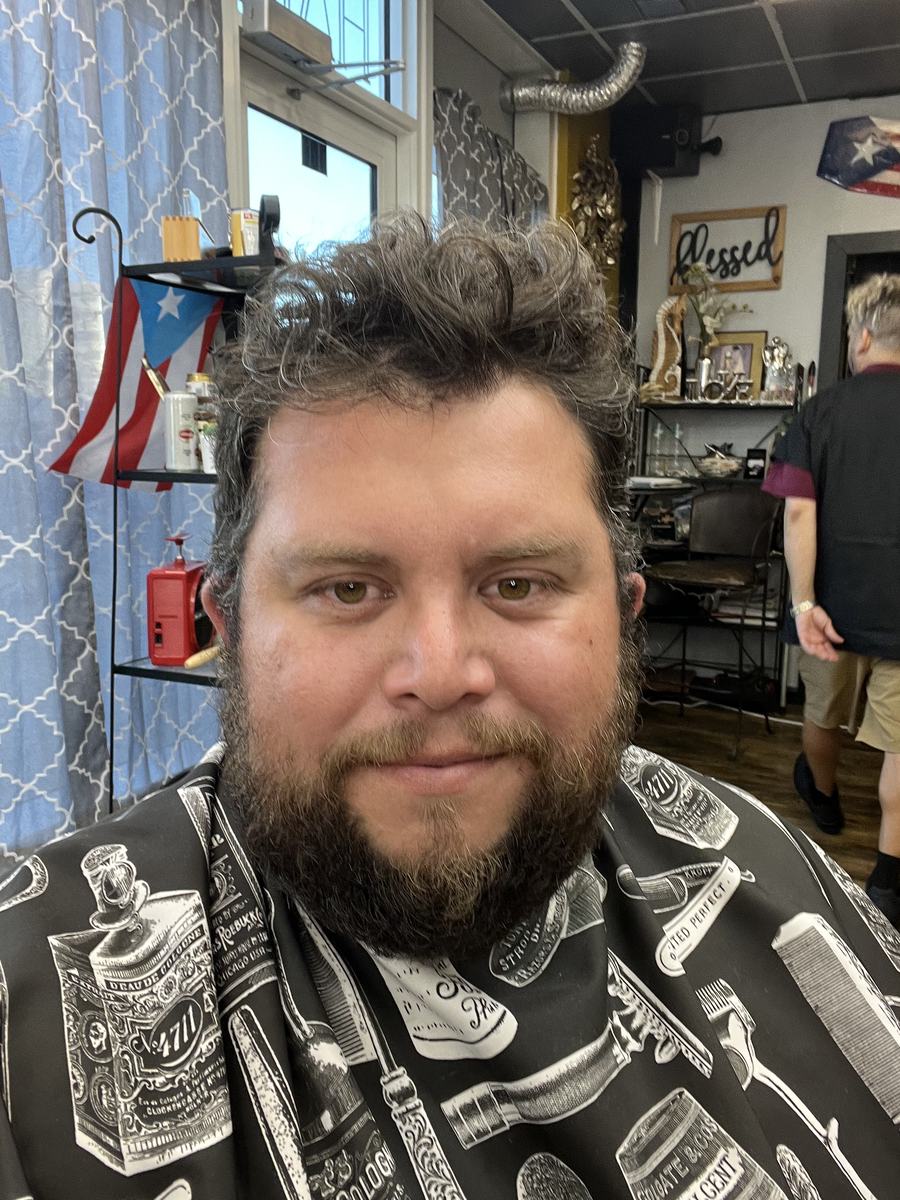 Mark Gabrielli in a barber shop